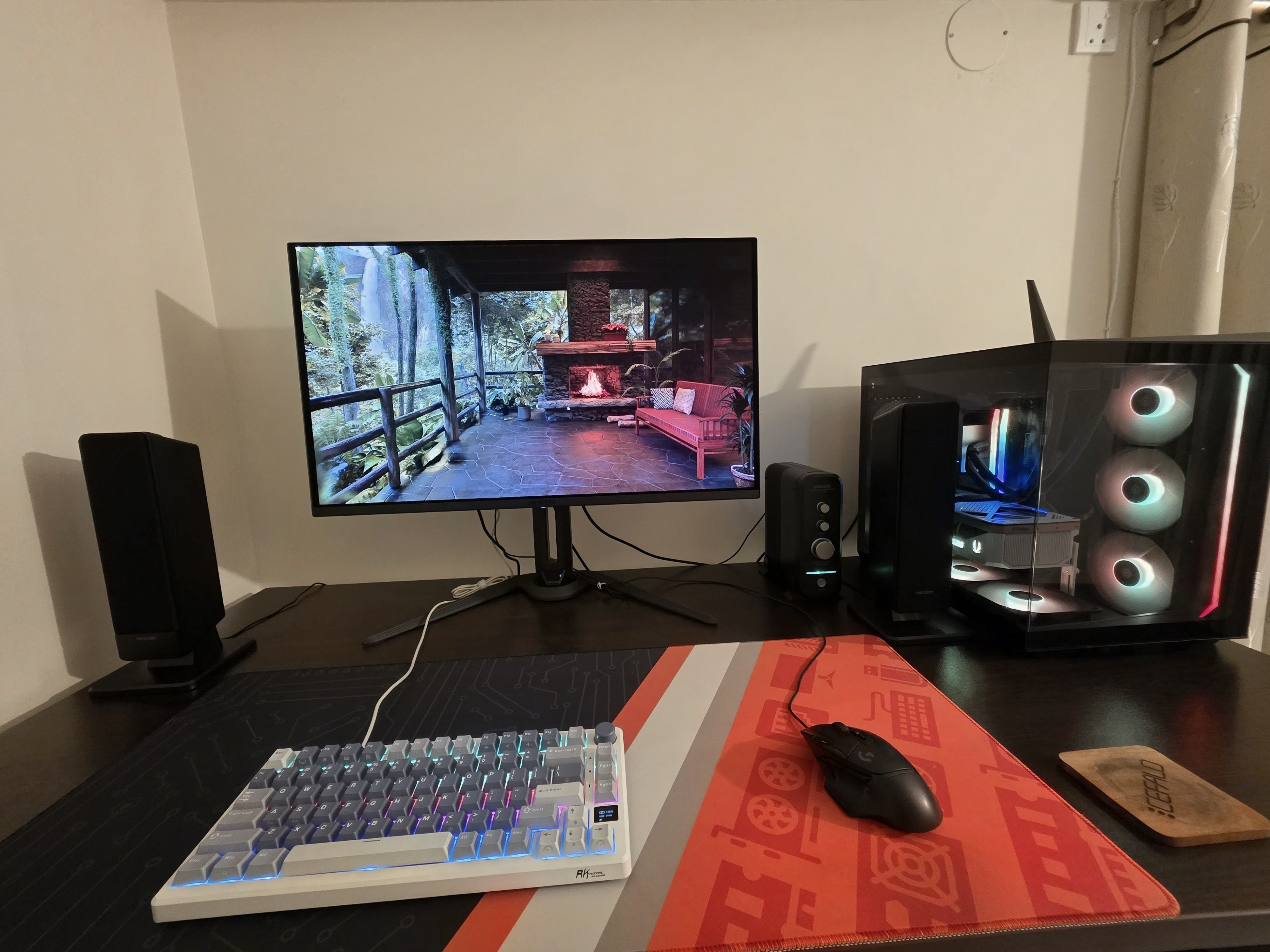 My desk: monitor, mechanical keyboard, RGB PC tower, speakers